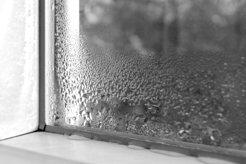 Condensation buildup on glass illustrating humidity and moisture exposure risks that can damage sensitive electrical equipment during data center construction.